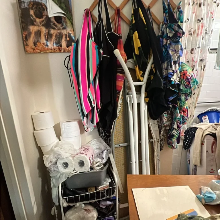 Closet packed floor to shelf with hanging clothes and bags